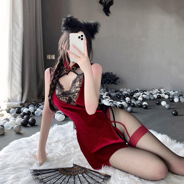 A woman poses in a red classic chinese qipao lingerie set, featuring lace backless design and sexy allure, perfect for intima...