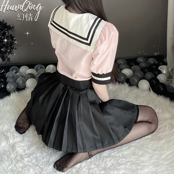 Sexy sailor uniform costume for women, schoolgirl role play outfit featuring a pink blouse with sailor collar and pleated bla...