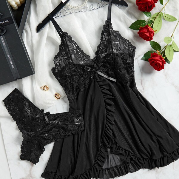 Black lace slip dress and matching panties set with sheer mesh, elegant qny style lingerie for women, displayed with roses.