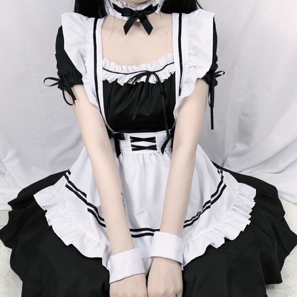 Cute maid cosplay dress featuring black and white colors, ruffled sleeves, and a bow collar, perfect for japanese lolita styl...