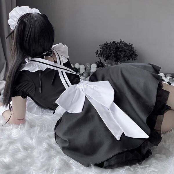 Cute maid costume cosplay dress featuring a black and white ruffled design with a large bow, perfect for plus-size women look...