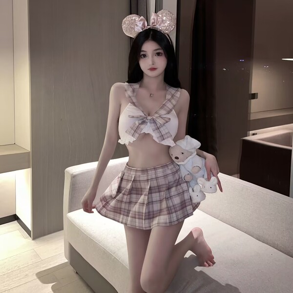 Cute plaid jk skirt outfit with lace-up top and bow headband, perfect for schoolgirl style summer looks.