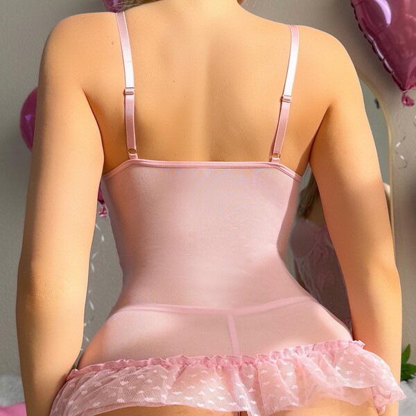 Sexy sheer bodysuit with lace trim and cut-outs, perfect for romantic evening wear.