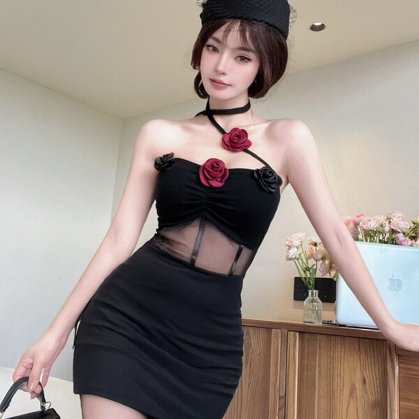Woman wearing black mesh lace floral halter bodysuit with red roses, backless bodycon dress for sexy evening style.