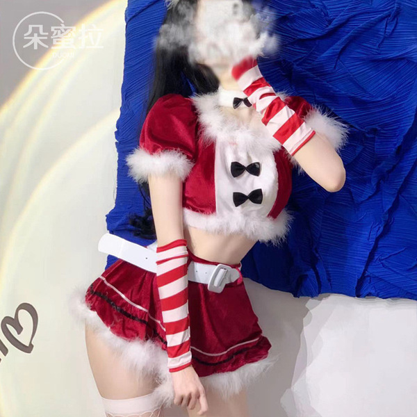 A woman models a festive christmas bunny girl costume, featuring a red and white striped outfit with fur accents, perfect for...