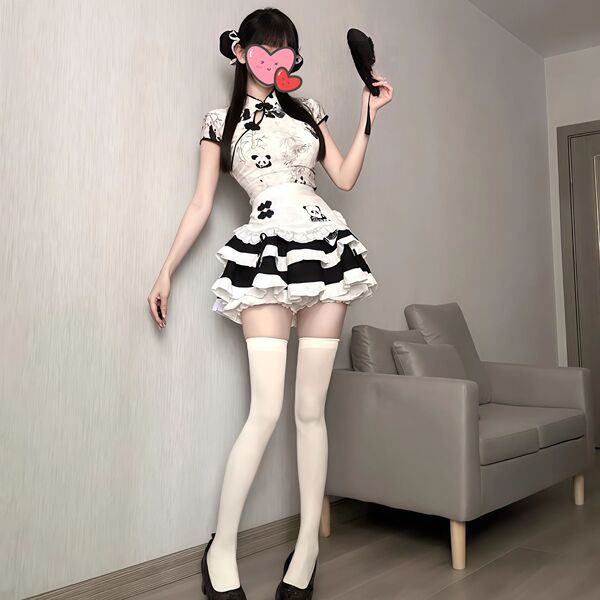 A woman poses in a cute panda-themed domoira chinese-style maid outfit, featuring a ruffled skirt and thigh-high stockings, p...