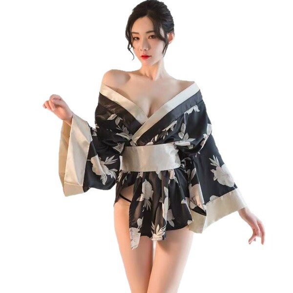 A woman models a black floral-patterned japanese kimono-style lingerie, featuring off-shoulder design, wide sleeves, and a de...