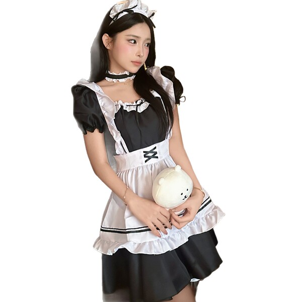 A woman wearing a black and white maid costume, holding a plush bear, ideal for cosplay and role play.