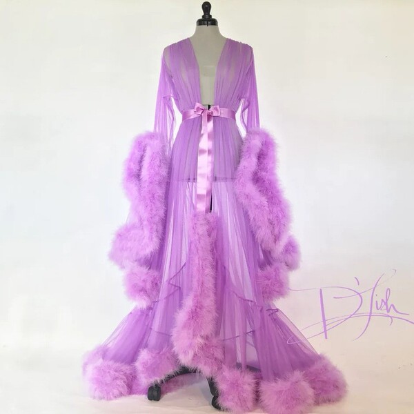 Elegant feather sleeve gown with sheer fabric and dramatic train, perfect for evening wear or sleepwear sets featuring luxuri...