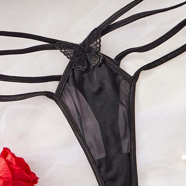 Black sheer lingerie set with lace butterfly detail and strappy design, bold euro-style sensual underwear.