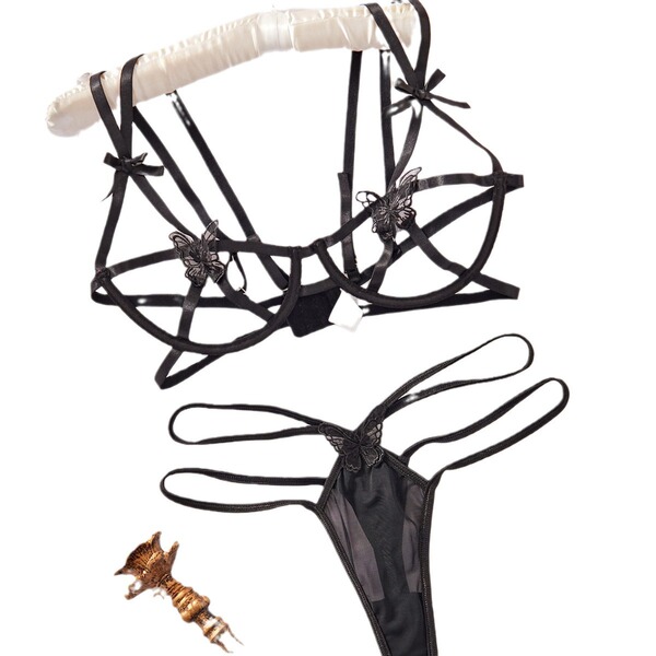 Black lace lingerie set with butterfly details, sheer bra and thong, plus gold accessory – bold euro-style sensual underwear.