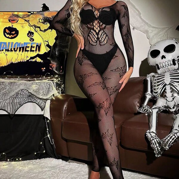 Woman modeling black lace cut-out bodycon mini skirt set with halter backless design, perfect for halloween.