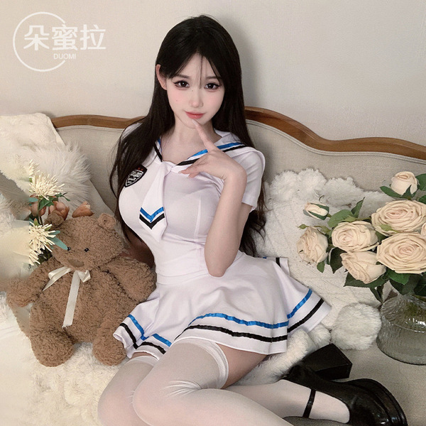 A woman poses wearing a domoira sexy lingerie set, featuring an innocent jk sailor style costume with maid and cosplay elemen...