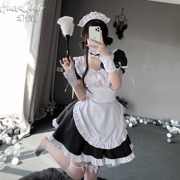 A woman poses in a fantasy romance maid dress, featuring a cute pure-yuri lolita apron outfit inspired by anime. the black an...