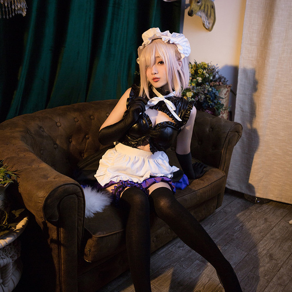 Cosplayer dressed as mash kyrielight from fate grand order, wearing an official anime maid costume with black and white attir...