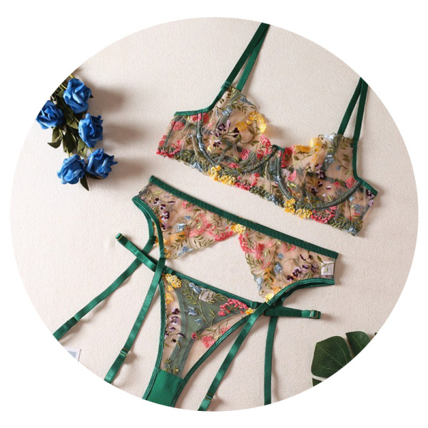 Floral embroidery lace bra set with sheer underwire and matching garter panties, featuring green straps and vibrant floral de...