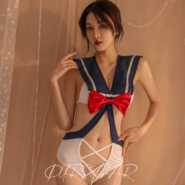 Woman modeling sailor-style cut-out bodysuit with red bow, white lace detailing, and strappy bottom for role play or intimate...