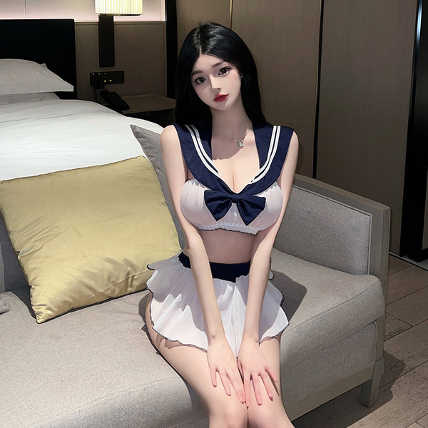 A woman sits on a couch wearing a stylish flower moon seduction lingerie set featuring a sailor-style top with a butterfly bo...