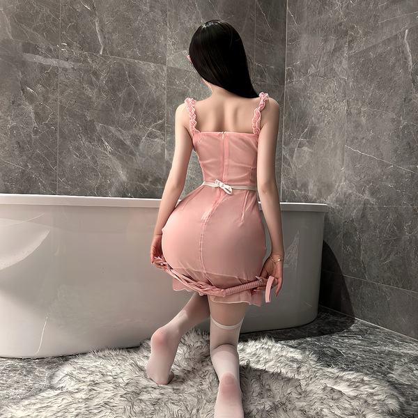 A woman stands by a bathtub wearing a pink flybird moon gazer cosplay outfit, featuring delicate lace details and a sweet mai...