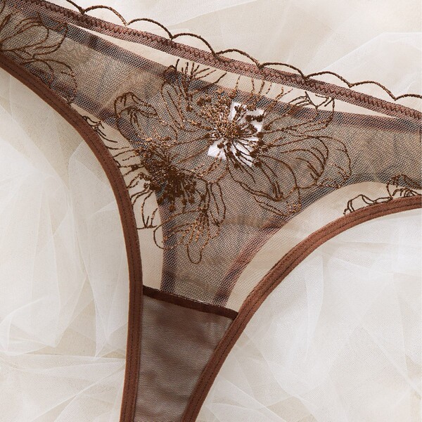 Sheer lace lingerie with floral embroidery, scalloped edges, and delicate mesh — elegant european-style intimate wear for pur...