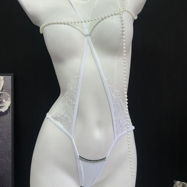 French-style lace mesh bikini panties featuring sheer cross-strap design with cotton crotch, offering sexy and elegant look.