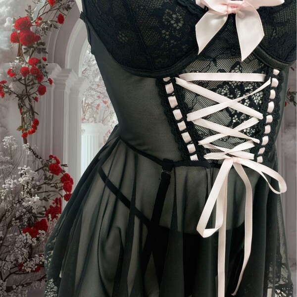 Black french lace chemise nightgown with sheer back, white ribbon lacing, bow detail, and matching thong for sensual sleepwea...