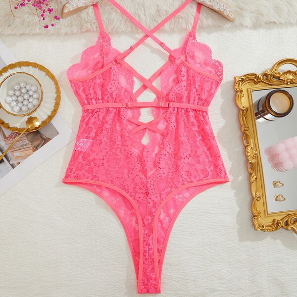 Pink lace bodysuit with crisscross straps, elegant design, perfect for women seeking sexy european-style erotic lingerie.