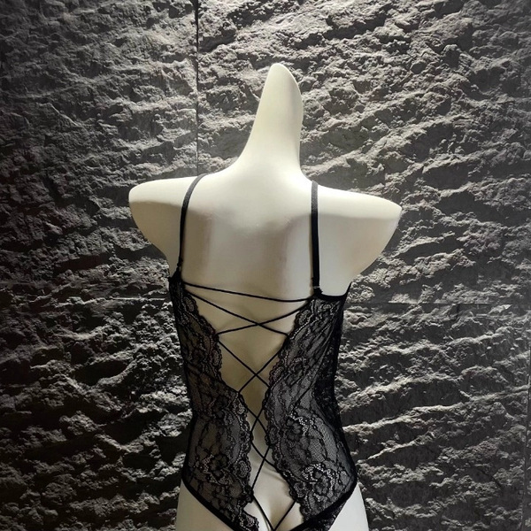 Glowing cloud sexy open-crotch leather bodysuit featuring cross-tie lace design and bell charm, perfect for women seeking ele...