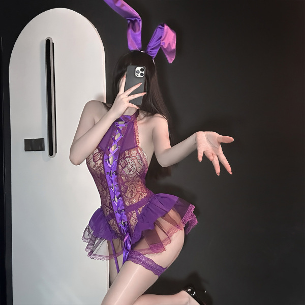 Woman in purple lace bunny lingerie set with ears, posing seductively in front of mirror — golden night sexy bunny girl linge...