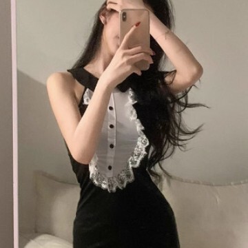 A woman models a black gomeng lingerie set featuring a catwoman bunny skirt with heart cutouts and no-remove design, captured...
