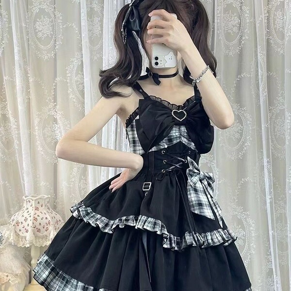 Gothic rock lolita strap dress featuring dark twin black and red plaid patterns with lace trimmings, perfect for edgy yet ele...