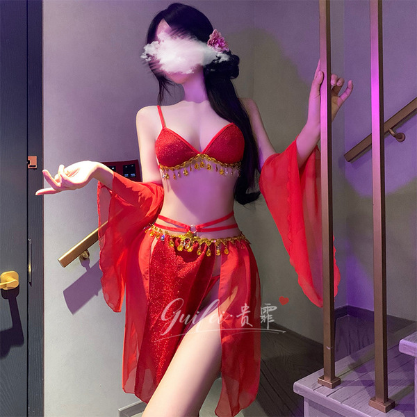 Exotic red silk flowy costume with tassel details, perfect for sensual allure and exotic vibes.