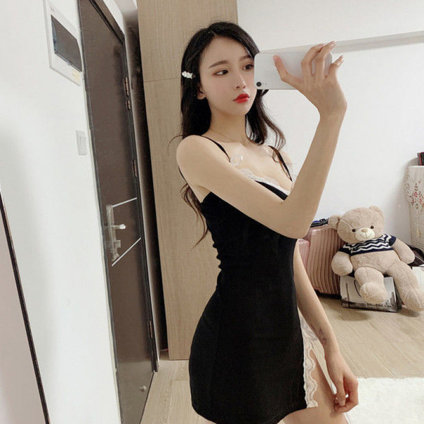 A woman poses with a teddy bear while wearing a black hanno sensual lingerie set, featuring lace details and designed for rom...