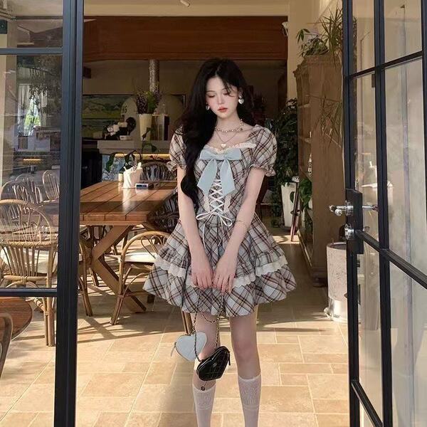 A stylish hazelnut latte plaid wrap waist dress featuring a charming bow detail, perfect for summer wear. ideal for petite wo...