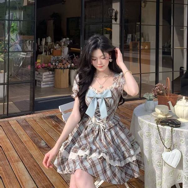 A stylish hazelnut latte plaid wrap waist dress with a charming bow, perfect for summer. ideal for petite women seeking a sli...