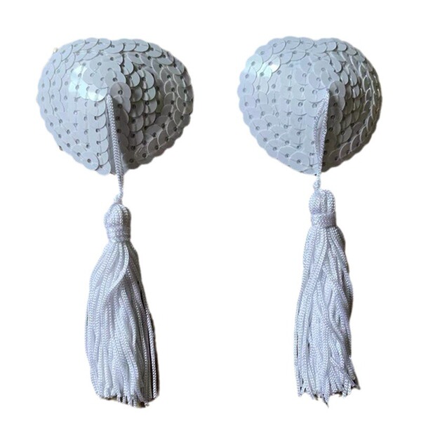 Heart-shaped silicone bra inserts with sequins and tassel trim for a flirty, sexy look.