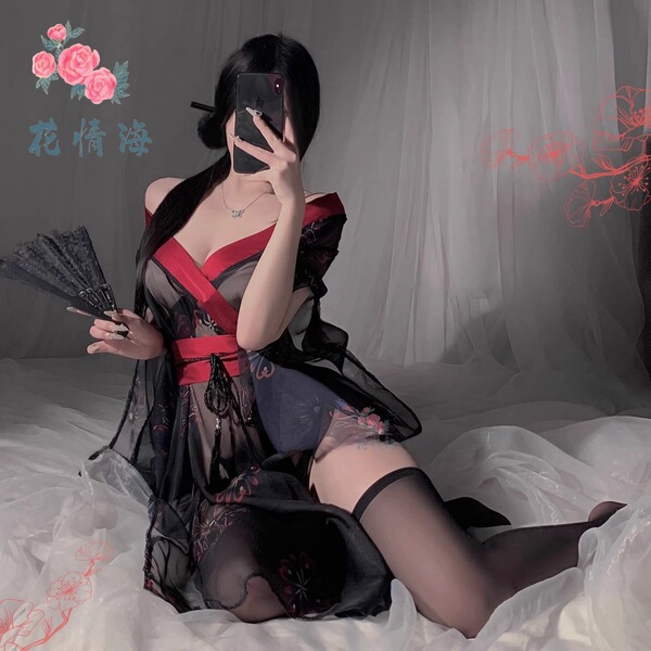 A woman poses in a black floral japanese-style lingerie kimono set, featuring a seductive design with no-remove stockings, em...