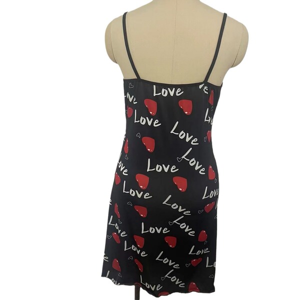 Sexy black dress adorned with red hearts and love text, featuring lace detailing and spaghetti straps, perfect for women seek...