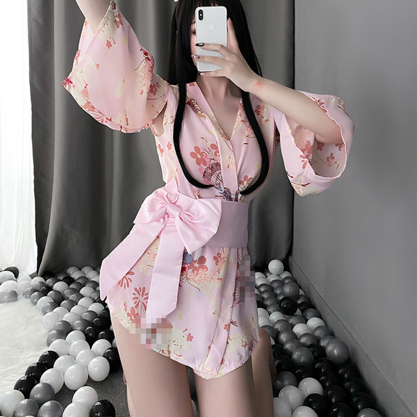 A woman poses in a pink floral japanese-style bunny kimono lingerie set, featuring a large bow and playful design, perfect fo...