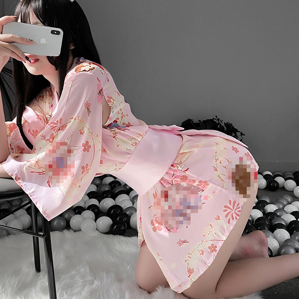 A woman poses in a pink japanese-style bunny kimono lingerie set, featuring floral patterns and flowing sleeves, perfect for ...