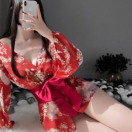 Japanese cherry blossom-themed kimono-style sleepwear with a red bow, featuring delicate floral patterns and elegant design.