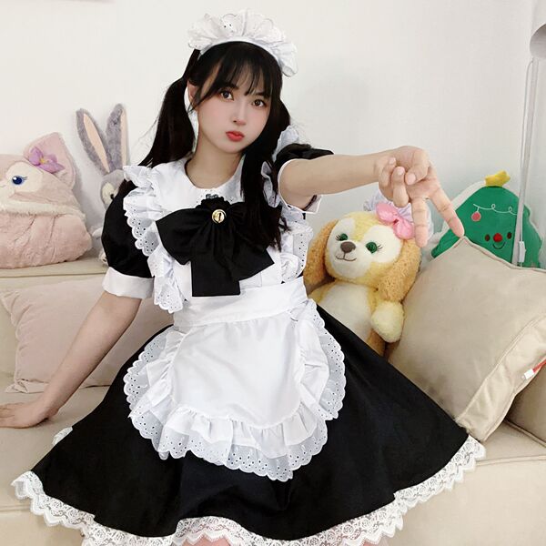 A woman wearing a japanese cute bunny maid cosplay dress, featuring black and white colors with lace details and a bow apron,...
