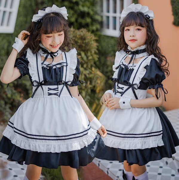 Two young girls wearing matching japanese girl black maid dresses, featuring ruffled details and bows, perfect for cute lolit...