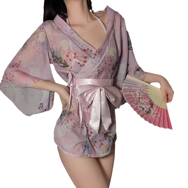 A woman models a new japanese kimono lingerie set featuring a pink yukata robe with floral patterns, accented by a bow detail...
