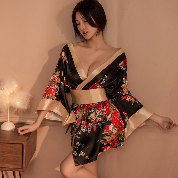 A woman poses elegantly in a black floral japanese kimono-style lingerie set, featuring a deep v-neckline and flowing sleeves...