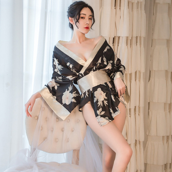 A woman poses elegantly in a black floral japanese kimono lingerie set, featuring a deep v-neckline and flowing fabric, perfe...