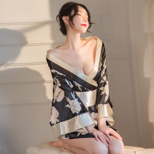 A woman poses elegantly in a japanese kimono-style lingerie set, featuring a floral print and seductive design, perfect for c...