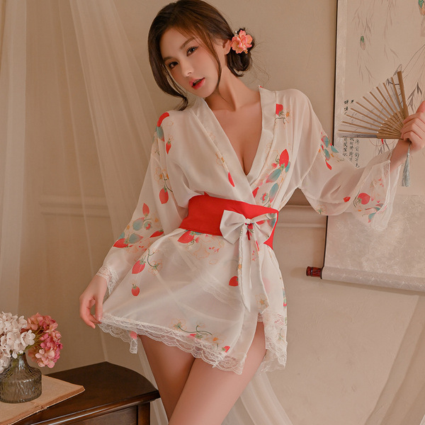 A woman wears a japanese kimono-style bathrobe with cherry blossoms, featuring an ice silk v-neck design, perfect for cosplay...