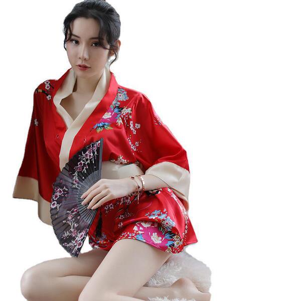 A woman wears a vibrant red japanese kimono-style robe set with floral patterns, holding a decorative fan, ideal for role pla...