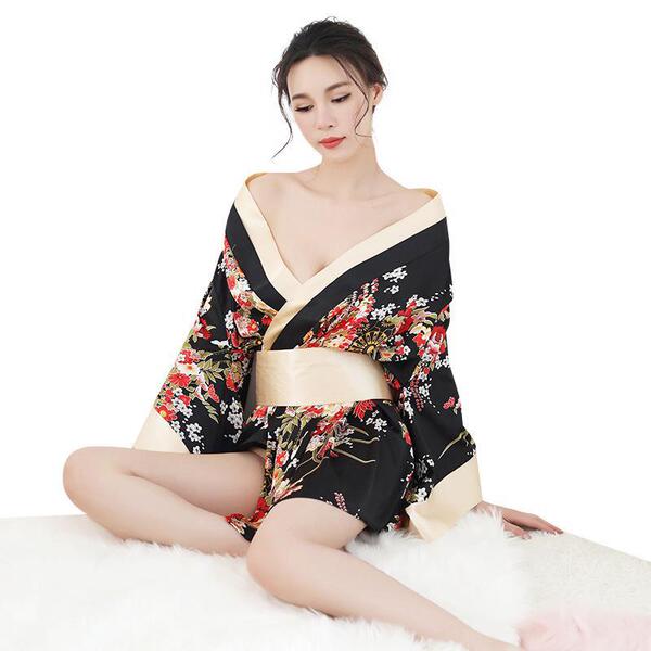 A woman models a japanese kimono-style sexy lingerie robe, featuring floral patterns and a deep v-neckline, perfect for playf...